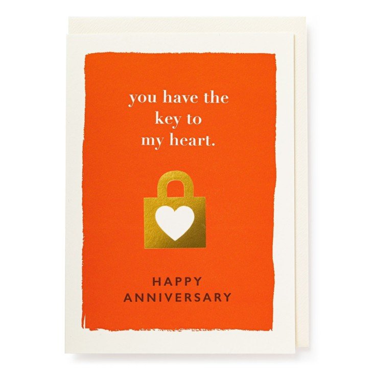 Card, cream envelope and red front with text you have the key to my heart and happy anniversary. There is a gold lockpad with a white heart.