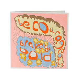 Greetings card, white envelope. Pale pink and gold front with a blue, gold lined cloud shape at the bottom. Text, be courageous. brave and bold.