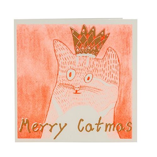 Greetings card, white envelope. Orange-pink front with a cat drawn in red. The cat wears a small crown with gold on it and text, merry catmas.