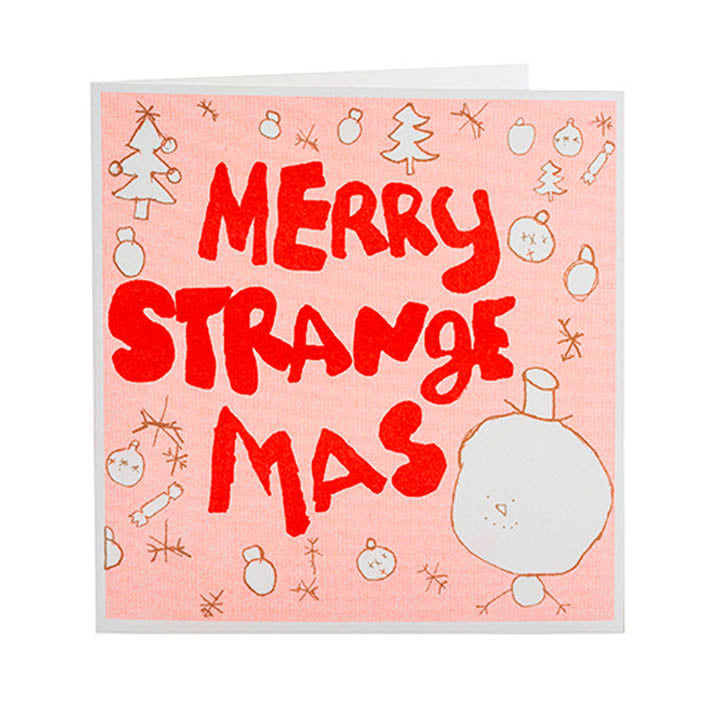 Greetings card, white envelope. Pale pink front with red bold handwriting reading merry strange mas.