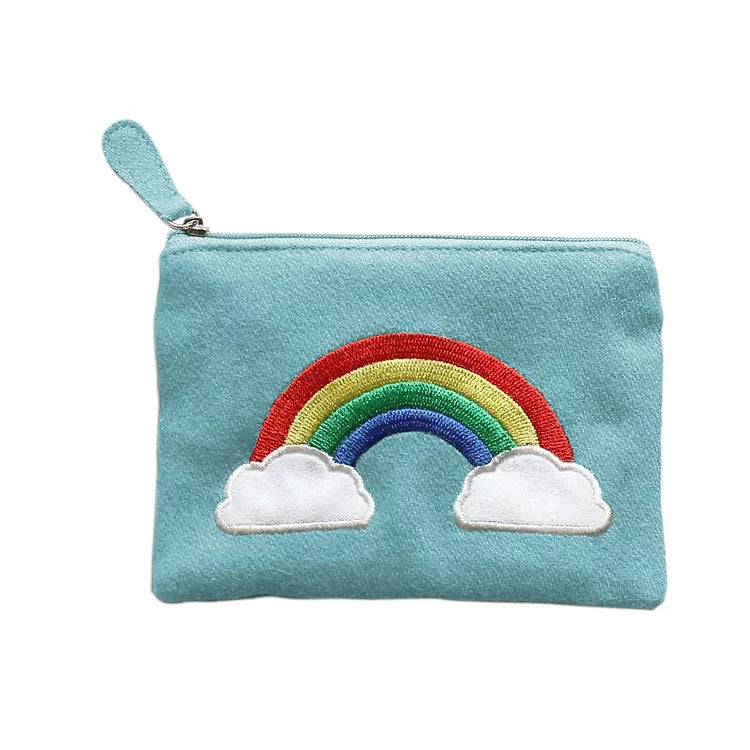 Turquoise felt purse with a rainbow embroidered.